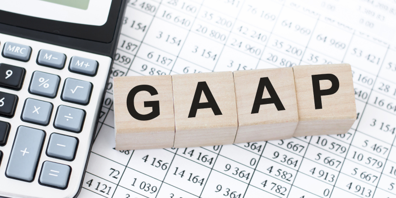 GAAP on wooden cubes illustrates the difference between IFRS & GAAP in the UAE.